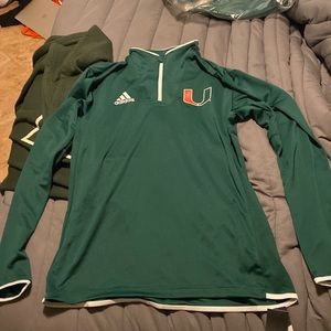 I am selling a brand new, green University of Miami half zip